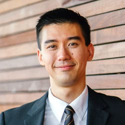 A Person In A Suit, Smiling Medical Care